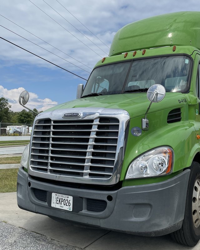 Green LMB Distributors Freightliner day cab, unit D-418